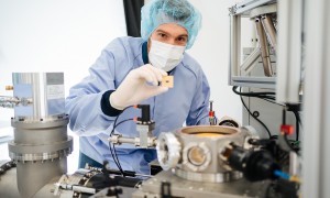 Man with Quantum Chip e1726671132990