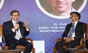 Left to Right Chris Miller Author participating in ‘Chip Pe Charcha with Dr. Satya Gupta President VLSI Society of India e1736182766822