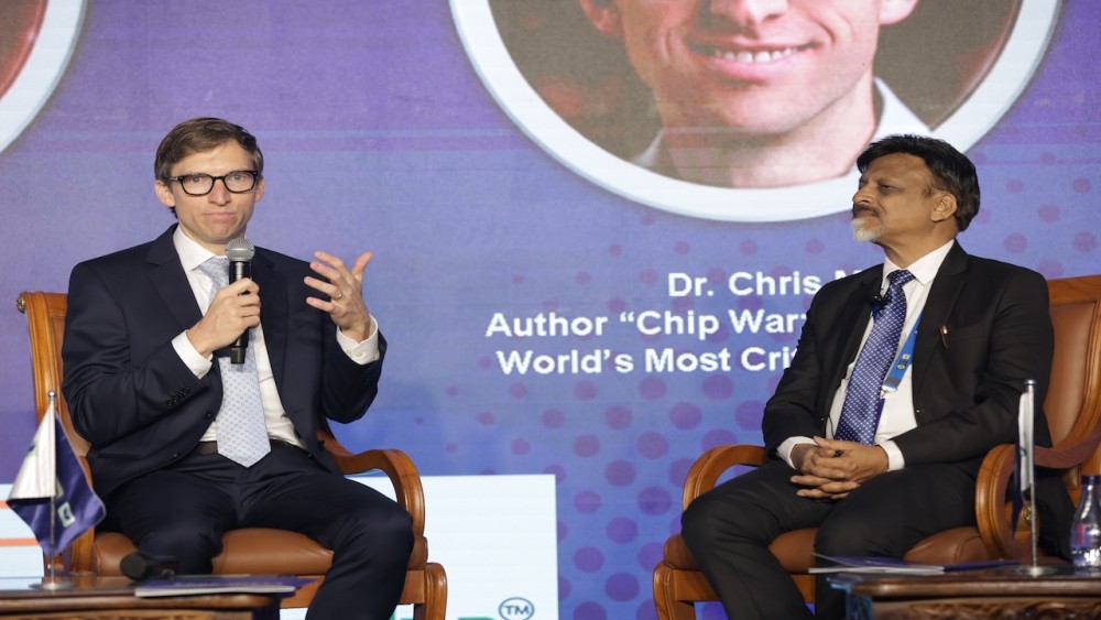 Left to Right Chris Miller Author participating in ‘Chip Pe Charcha with Dr. Satya Gupta President VLSI Society of India e1736182766822